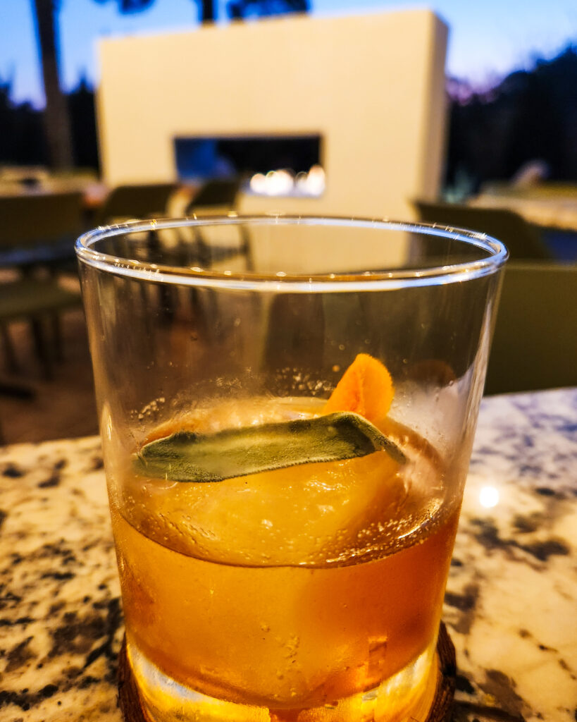 CONTROL BURN at Vine & Olive in Tituscille SAGE BUTTERFAT WASHED WHISKEY, AGAVE, ORANGE BITTERS, ANGOSTURA BITTERS, SMOKE